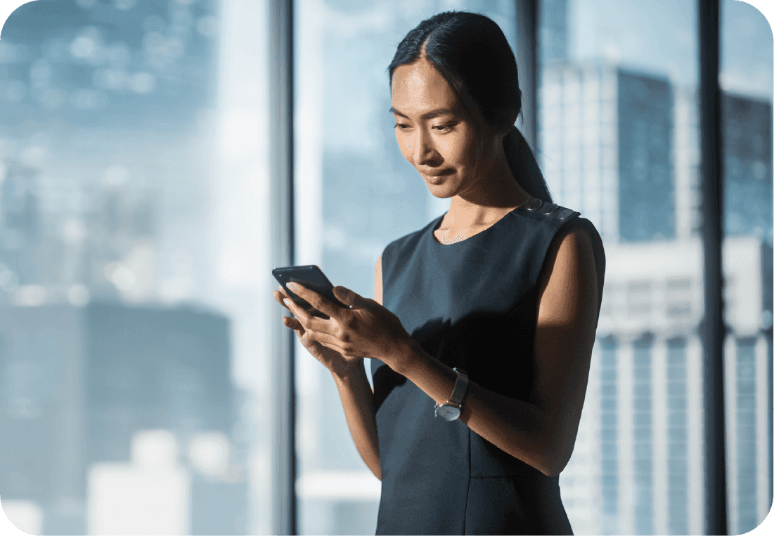 A business woman looking at her phone